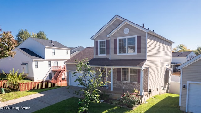 view of front property with a garage and a front yard