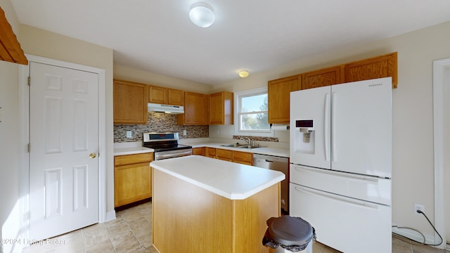 kitchen with light tile patterned flooring, sink, stainless steel appliances, backsplash, and a center island