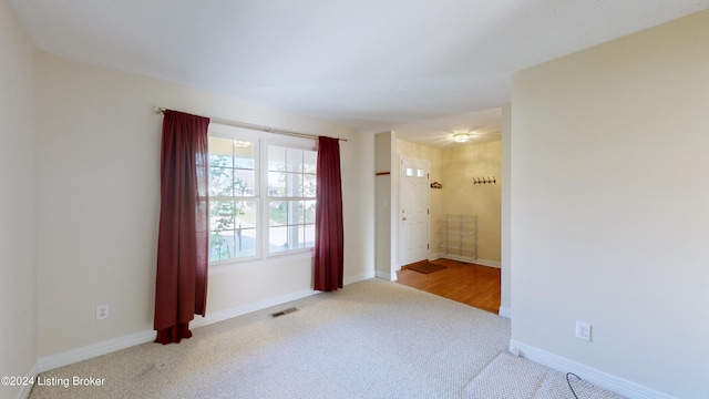 spare room featuring light hardwood / wood-style floors