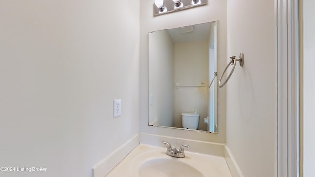 bathroom featuring sink and toilet