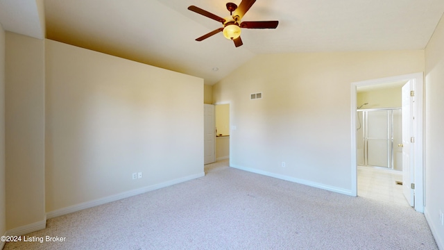 carpeted empty room with ceiling fan and lofted ceiling