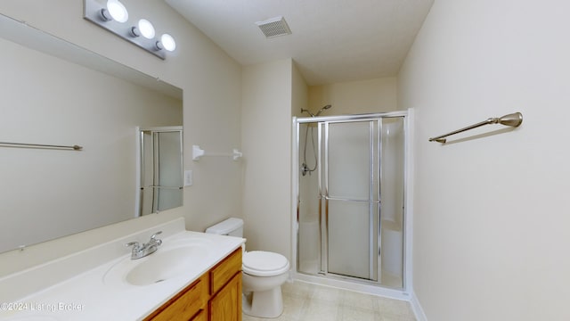 bathroom featuring walk in shower, vanity, and toilet