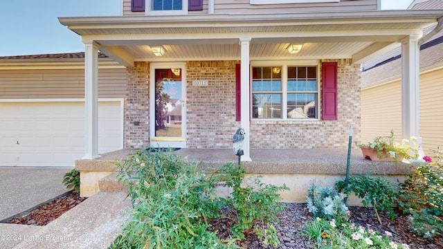 property entrance featuring a porch and a garage