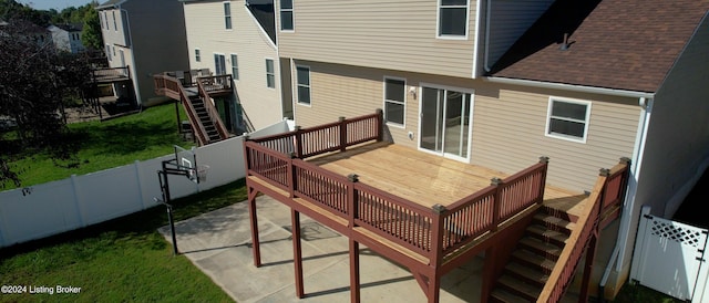 wooden deck with a patio area