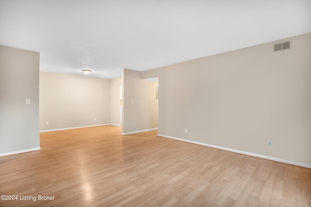 unfurnished room with light hardwood / wood-style floors