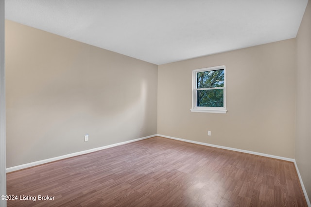 empty room featuring wood-type flooring