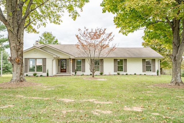 ranch-style home featuring a front yard