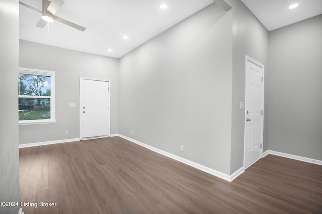 unfurnished room with dark hardwood / wood-style floors and ceiling fan