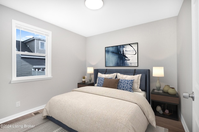 bedroom featuring wood-type flooring