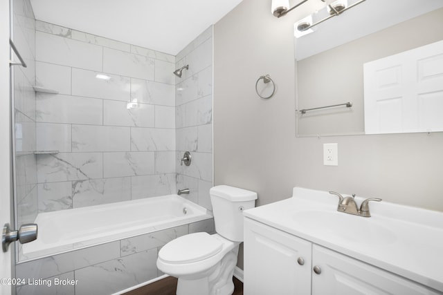 full bathroom with vanity, toilet, and tiled shower / bath combo