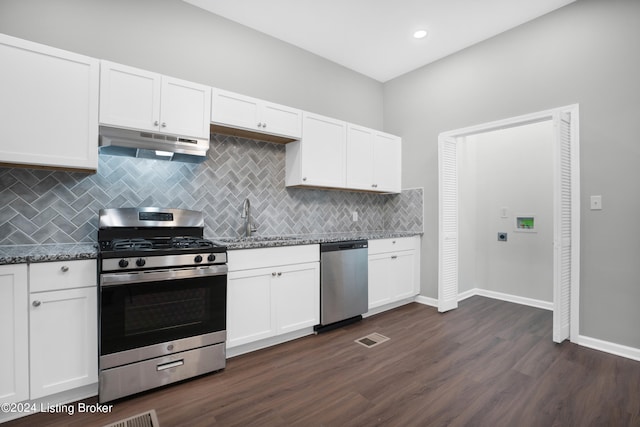 kitchen featuring dark wood-type flooring, white cabinets, and stainless steel appliances