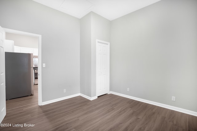 spare room featuring dark hardwood / wood-style flooring