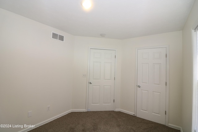 spare room featuring carpet flooring