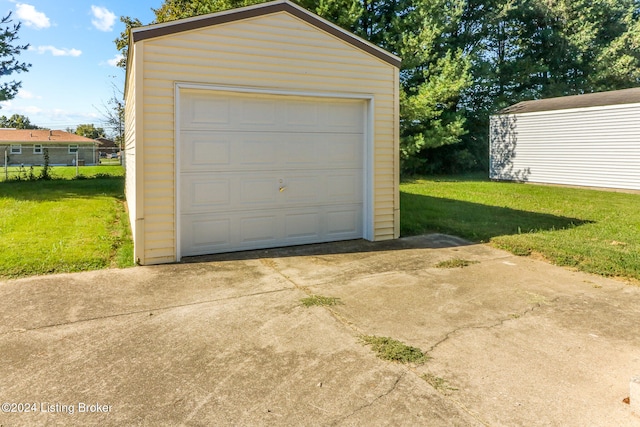 garage featuring a lawn