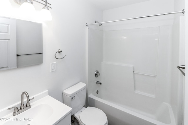 full bathroom featuring vanity, shower / tub combination, and toilet