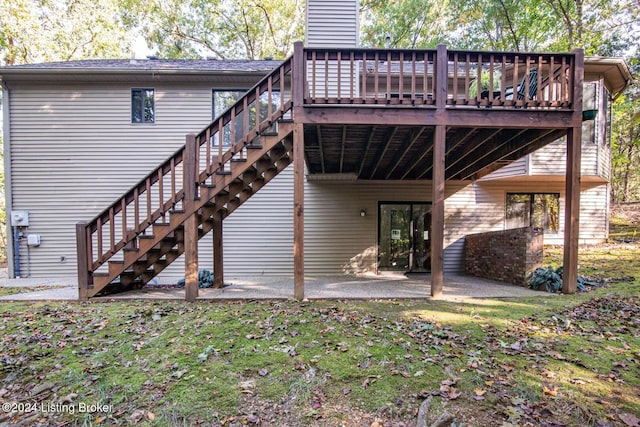 rear view of house featuring a deck and a patio