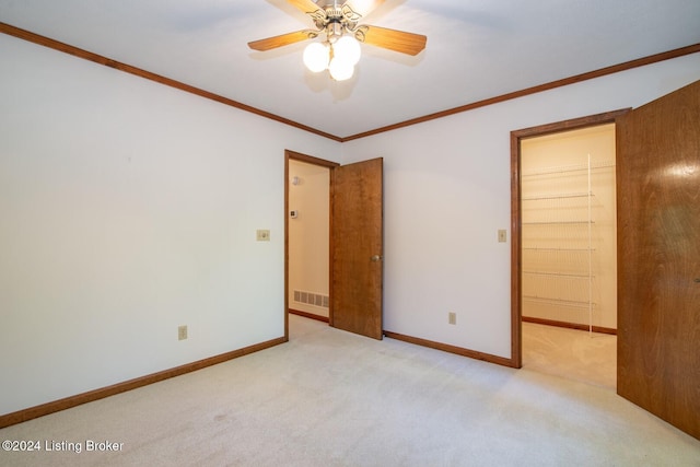 interior space featuring crown molding and ceiling fan