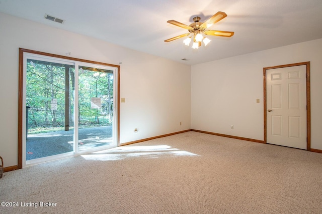 empty room with carpet and ceiling fan