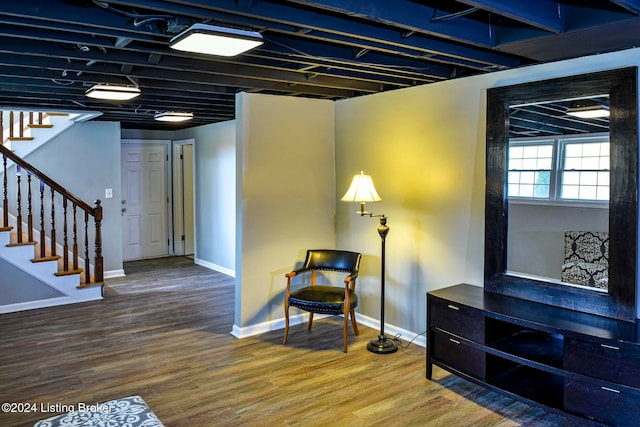 living area with hardwood / wood-style floors