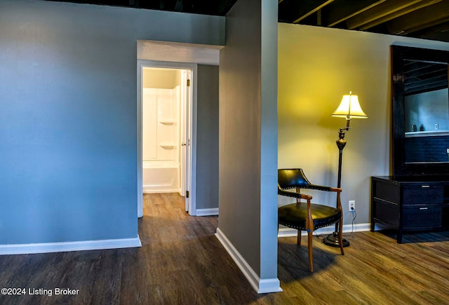 hall with dark wood-type flooring