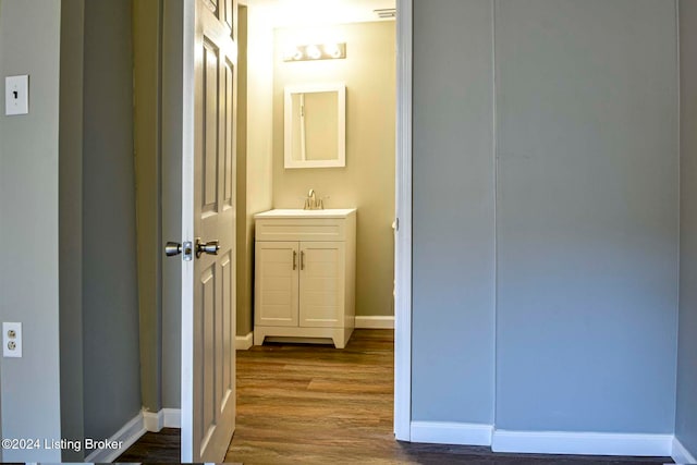 bathroom featuring vanity and wood-type flooring