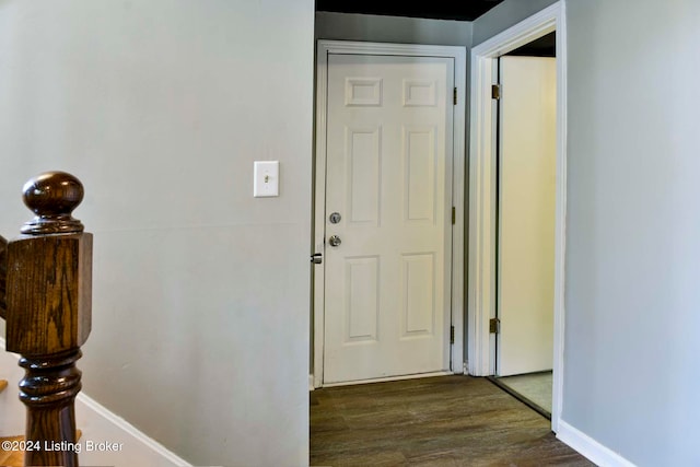 corridor featuring dark wood-type flooring