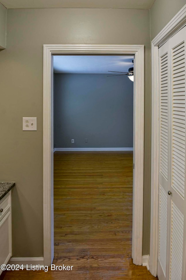 hall with dark wood-type flooring