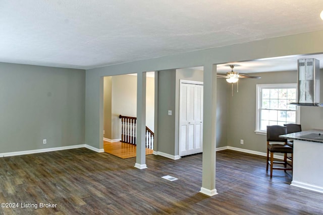 empty room featuring dark hardwood / wood-style flooring and ceiling fan