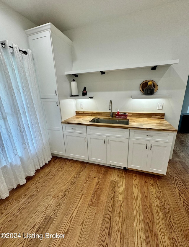 bathroom featuring sink and hardwood / wood-style flooring