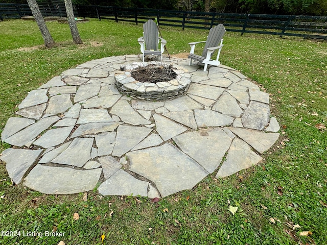 view of patio with an outdoor fire pit