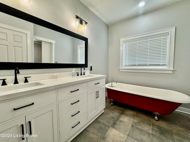 bathroom with vanity and a bathtub