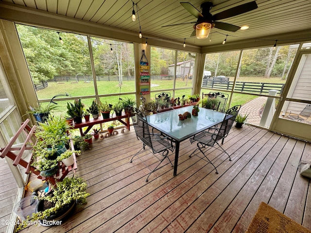 sunroom with wooden ceiling and ceiling fan