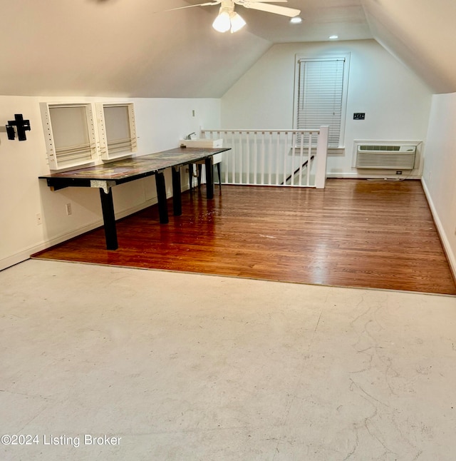 bonus room with ceiling fan, wood-type flooring, vaulted ceiling, and an AC wall unit