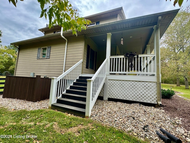 view of side of home with covered porch