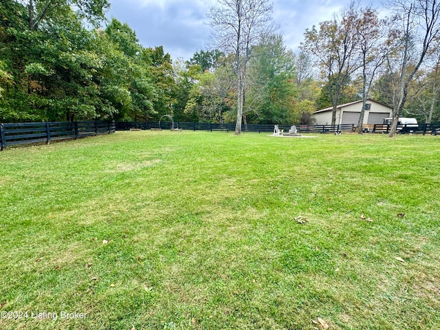 view of yard with a rural view