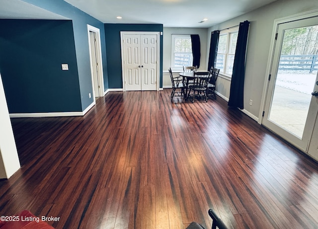 entryway with dark hardwood / wood-style flooring