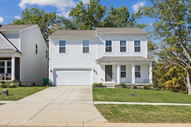 view of front of home featuring a front yard and a garage