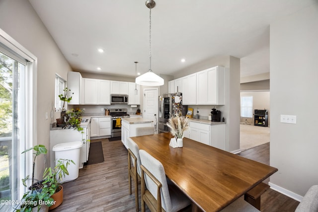 dining area with dark wood-type flooring