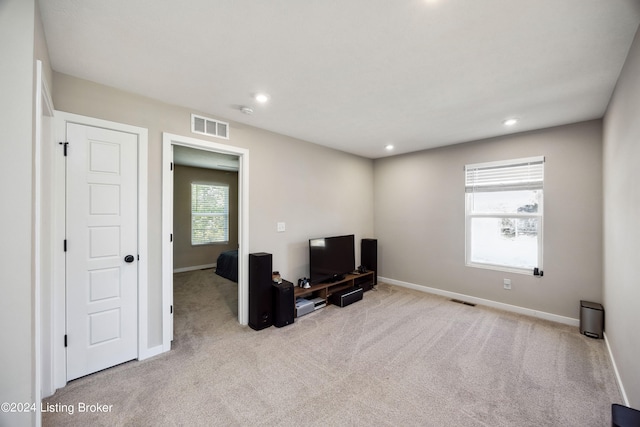 living area featuring light colored carpet