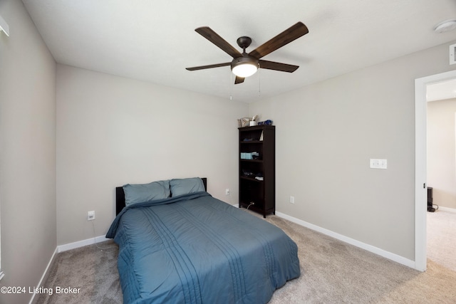 carpeted bedroom with ceiling fan