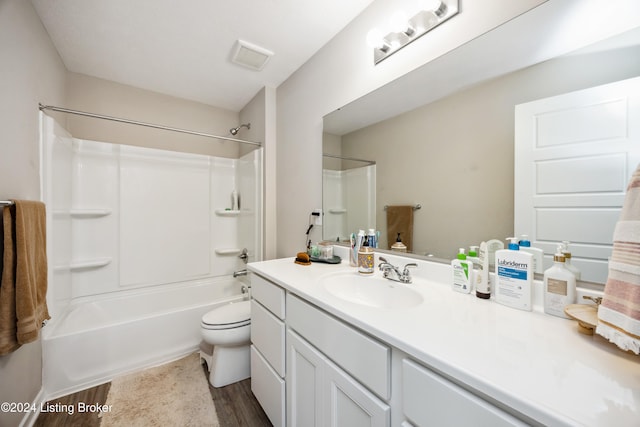 full bathroom with shower / tub combination, toilet, vanity, and wood-type flooring