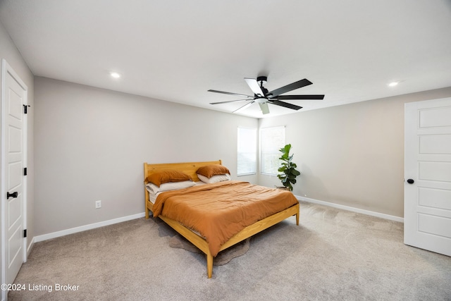 carpeted bedroom with ceiling fan