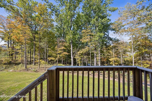 wooden terrace with a yard