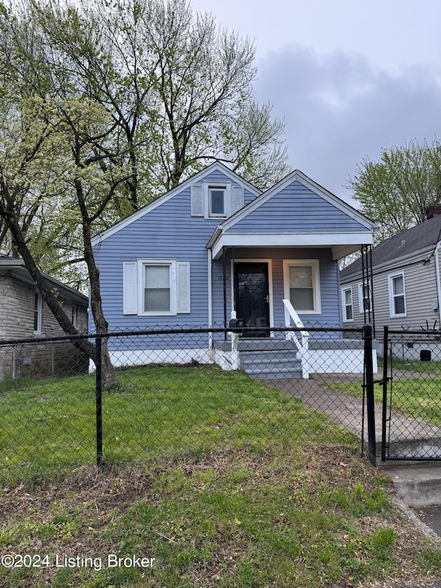 bungalow-style house featuring a porch and a front lawn