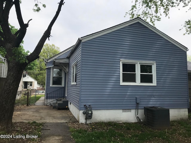 view of side of home with cooling unit