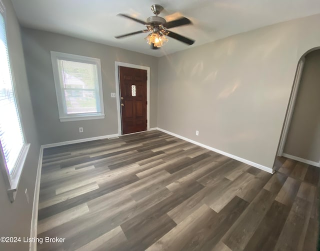 foyer entrance with ceiling fan and dark hardwood / wood-style floors