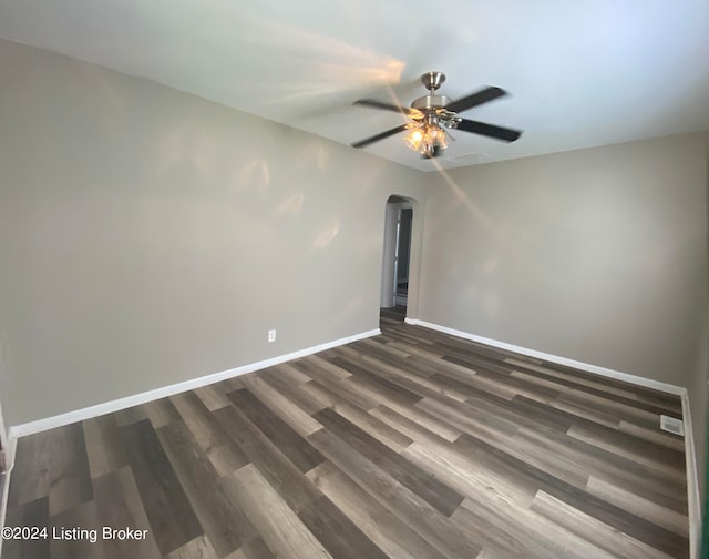 unfurnished room featuring ceiling fan and dark hardwood / wood-style floors