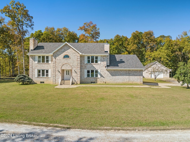 view of front facade with a garage and a front yard