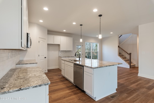 kitchen with white cabinetry, sink, a kitchen island with sink, and appliances with stainless steel finishes