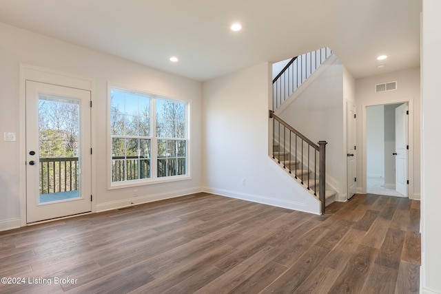 interior space with dark hardwood / wood-style floors